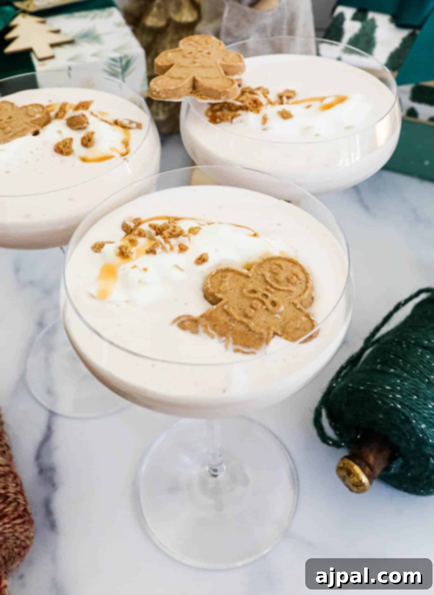 Gingerbread Spice Martini 7 Gingerbread martini garnished with whipped cream and gingerbread cookies.
