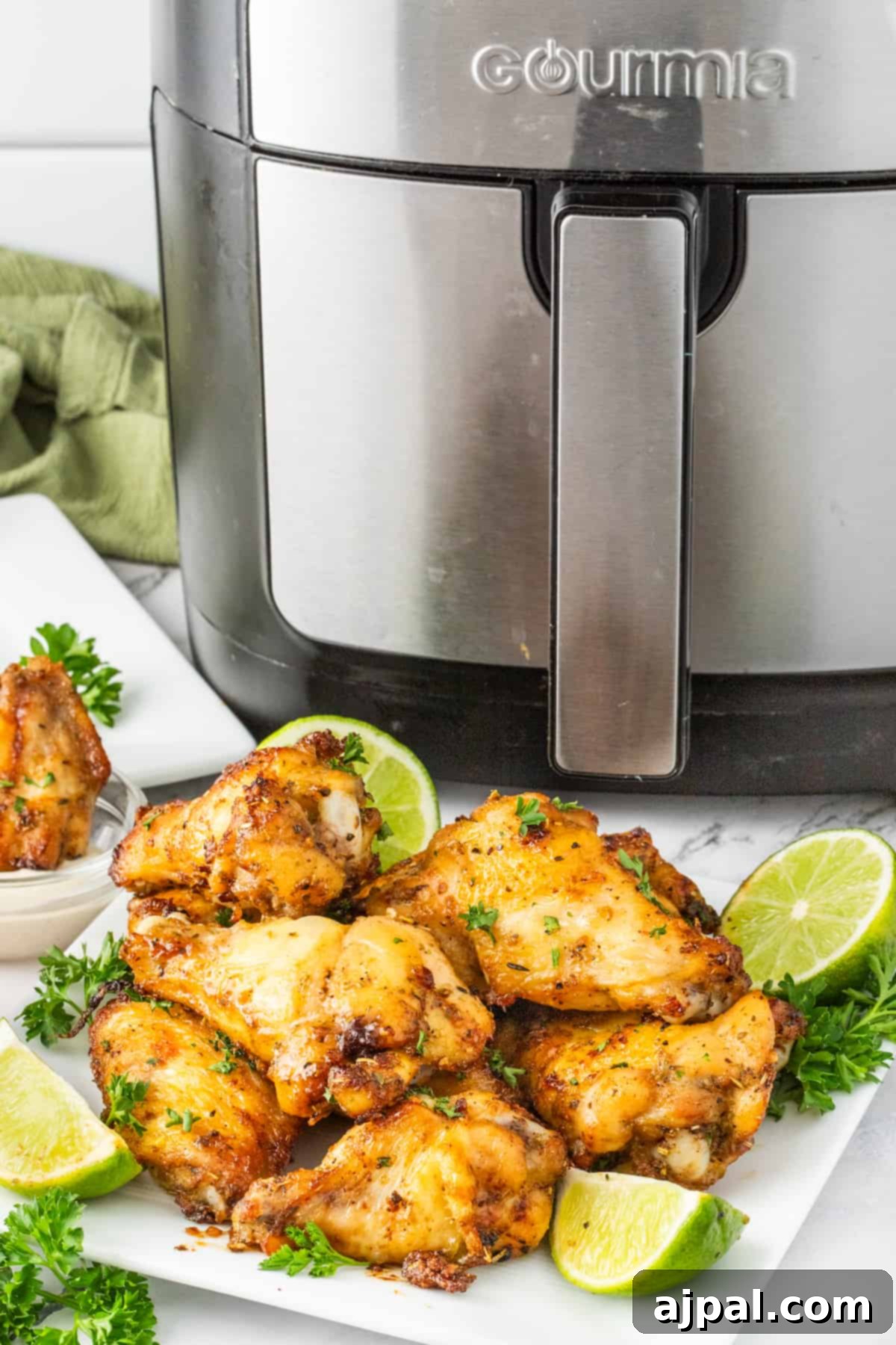 Crispy Air-Fried Wings 10 Air fryer chicken wings on a white plate, golden and ready to enjoy.
