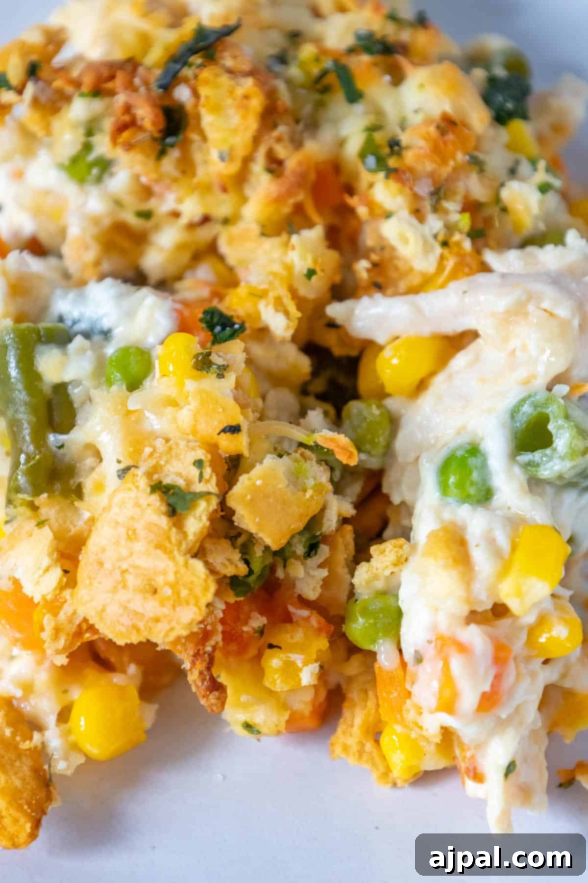 Creamy chicken casserole served on a white plate.