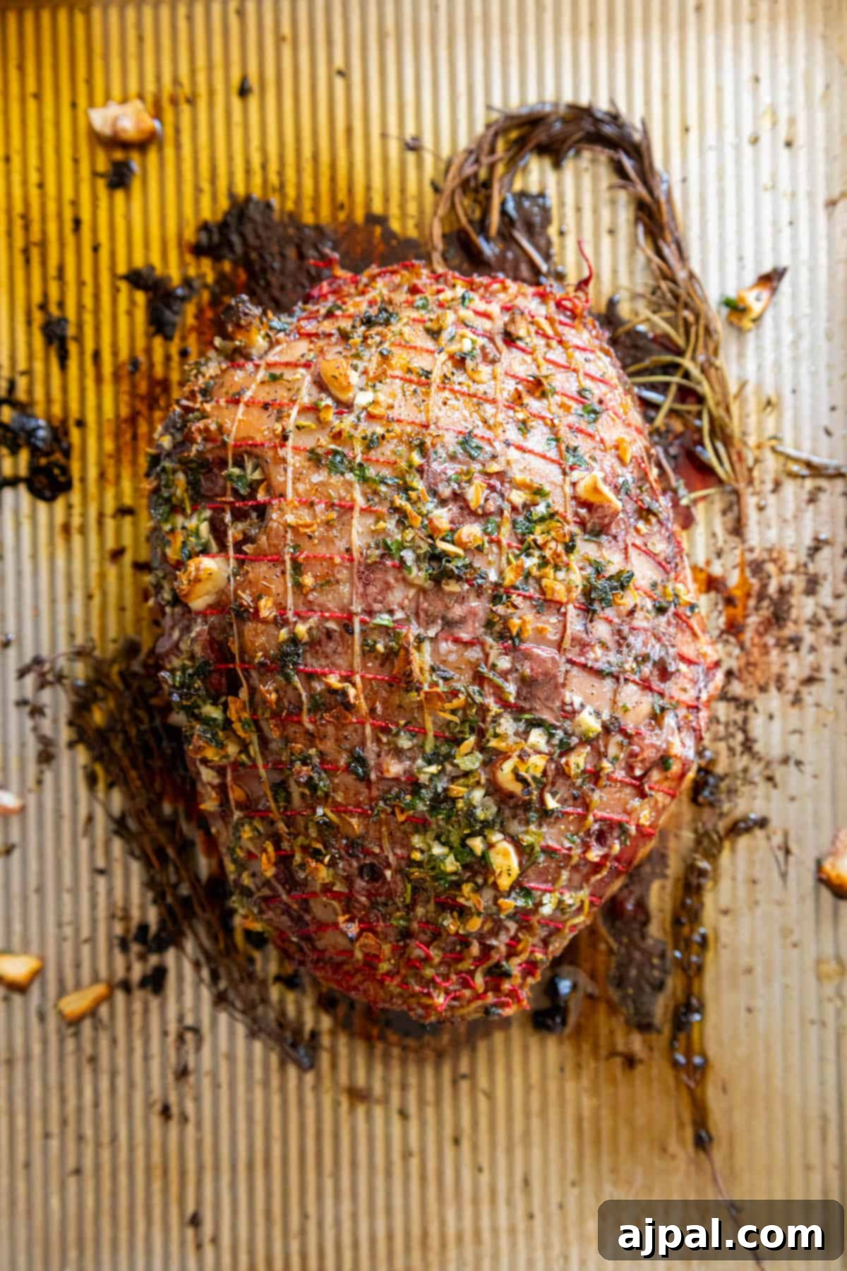Succulent Reverse Seared Lamb Leg 7 The leg of lamb placed on a roasting rack within a baking sheet, perfectly positioned for even slow roasting.