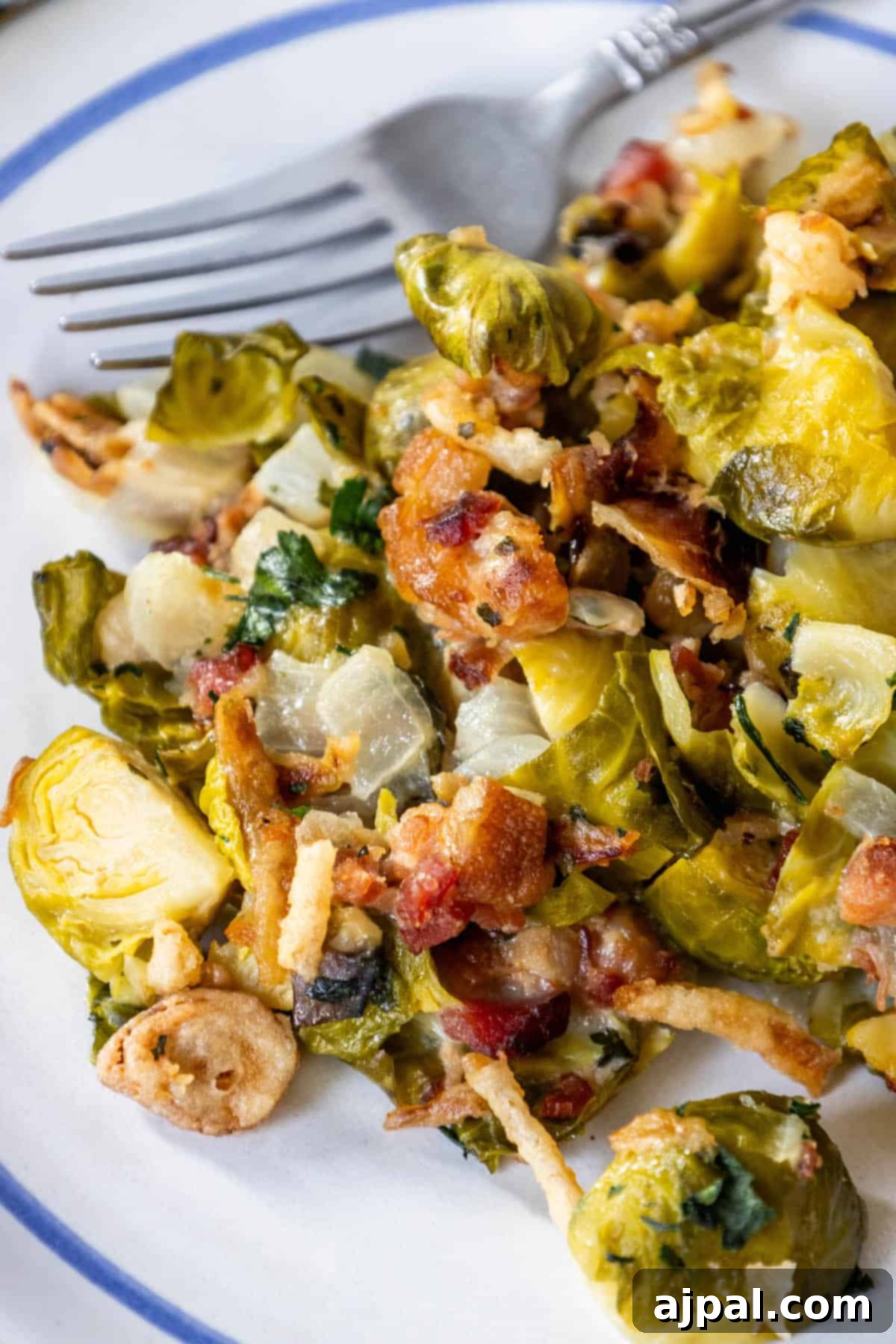 Bacon Brussels Bliss 5 A vibrant plate of creamy Brussels sprouts with bacon, garnished and ready.