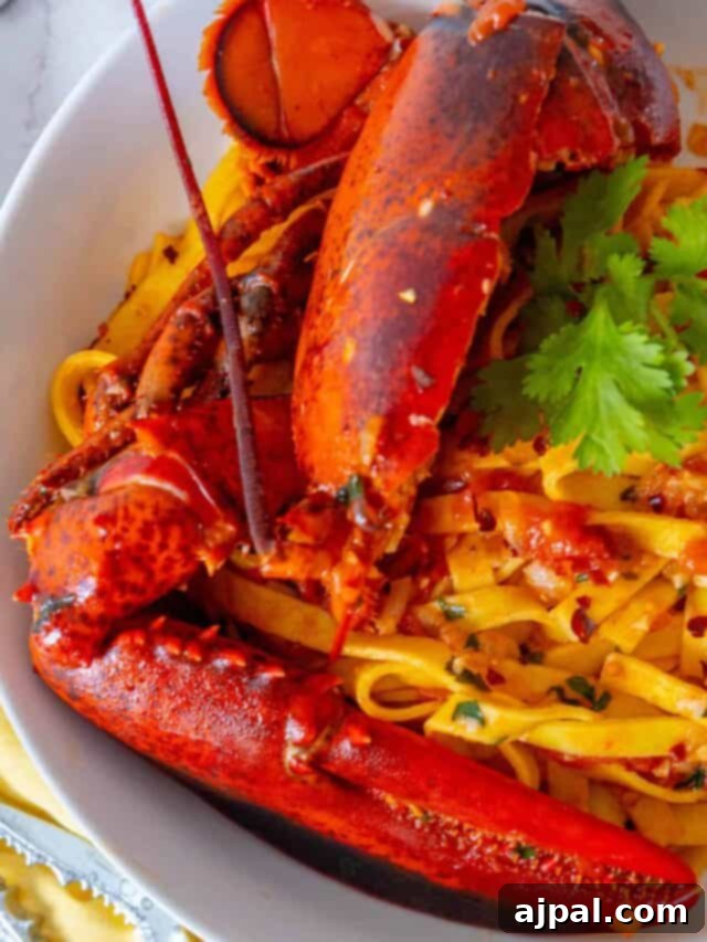 Exquisite Italian Lobster Pasta 4 Lobster pasta in a white bowl.
