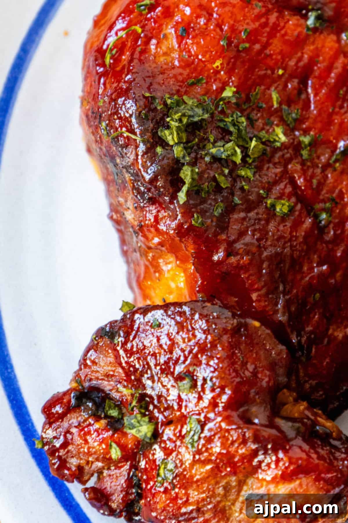 A boneless piece of BBQ pork rib on a plate.