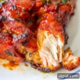 A close up of a baked piece of boneless pork rib on a plate.