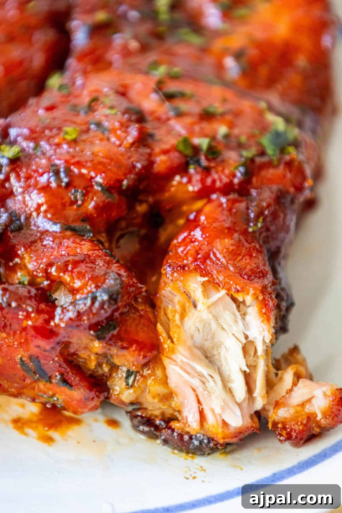 A boneless piece of BBQ pork rib on a plate.