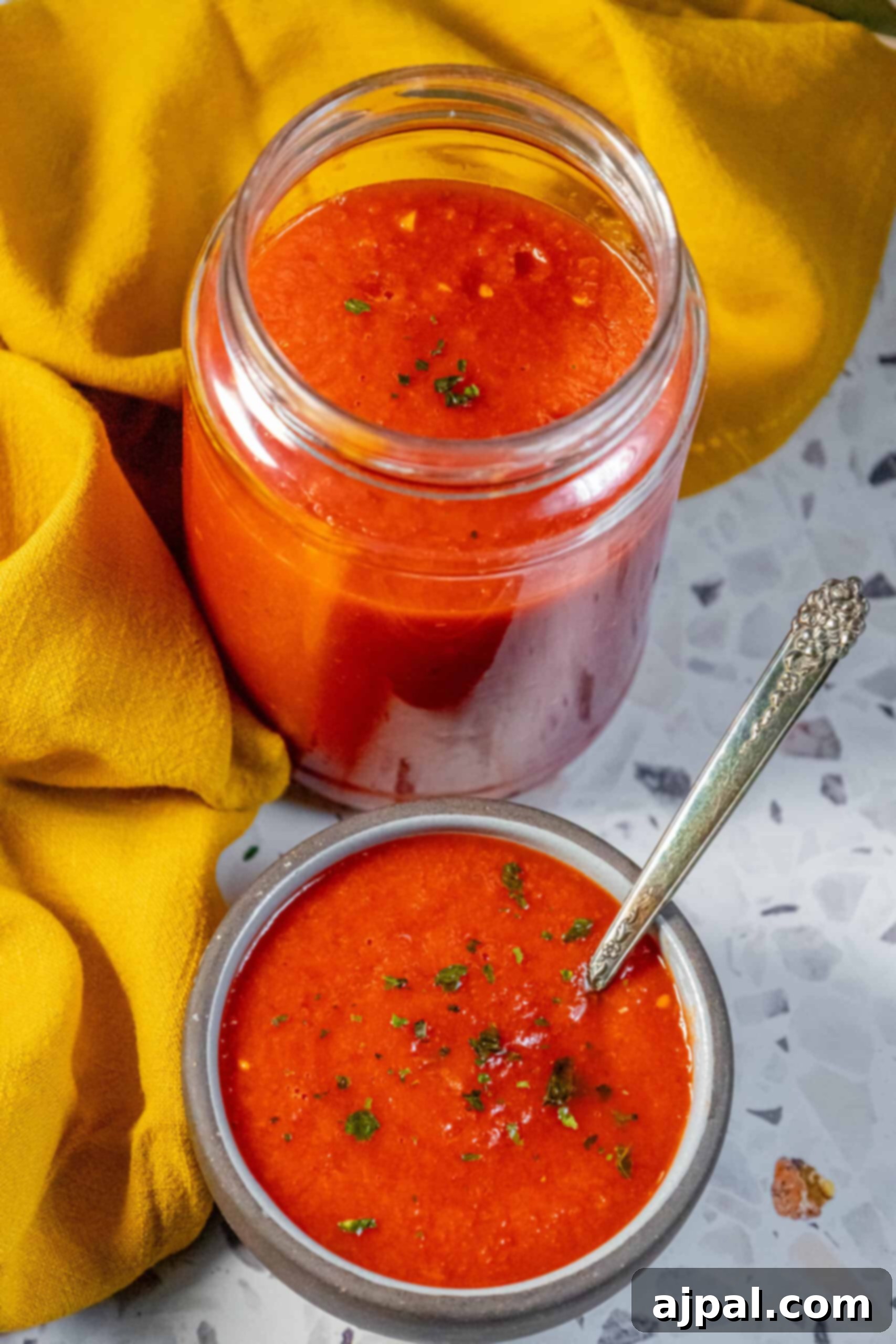 Freshly Made Margherita Pizza Sauce in a Glass Jar A charming jar of homemade Margherita sauce, freshly prepared and ready to enhance any Italian dish.