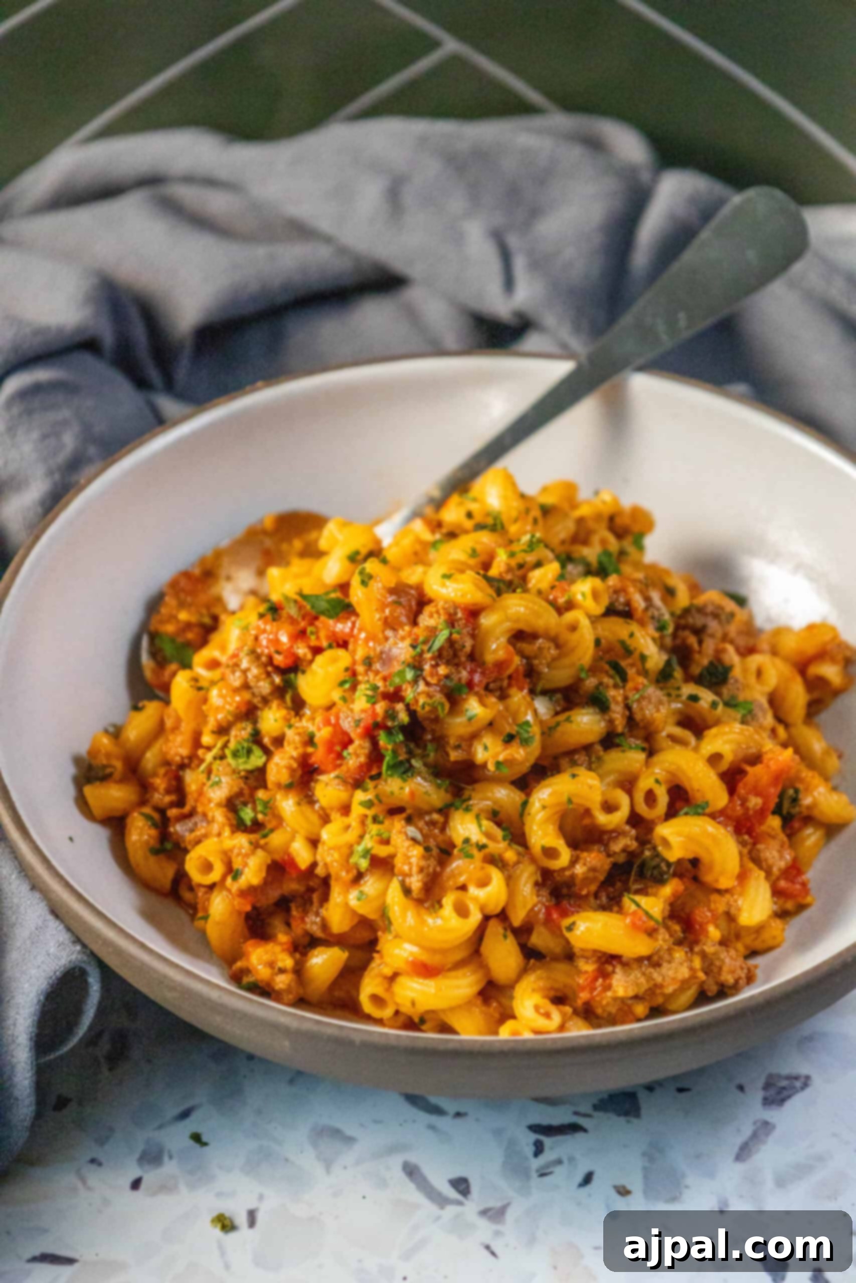 Homestyle American Goulash 10 An American Goulash recipe featuring a bowl of pasta with meat and vegetables.