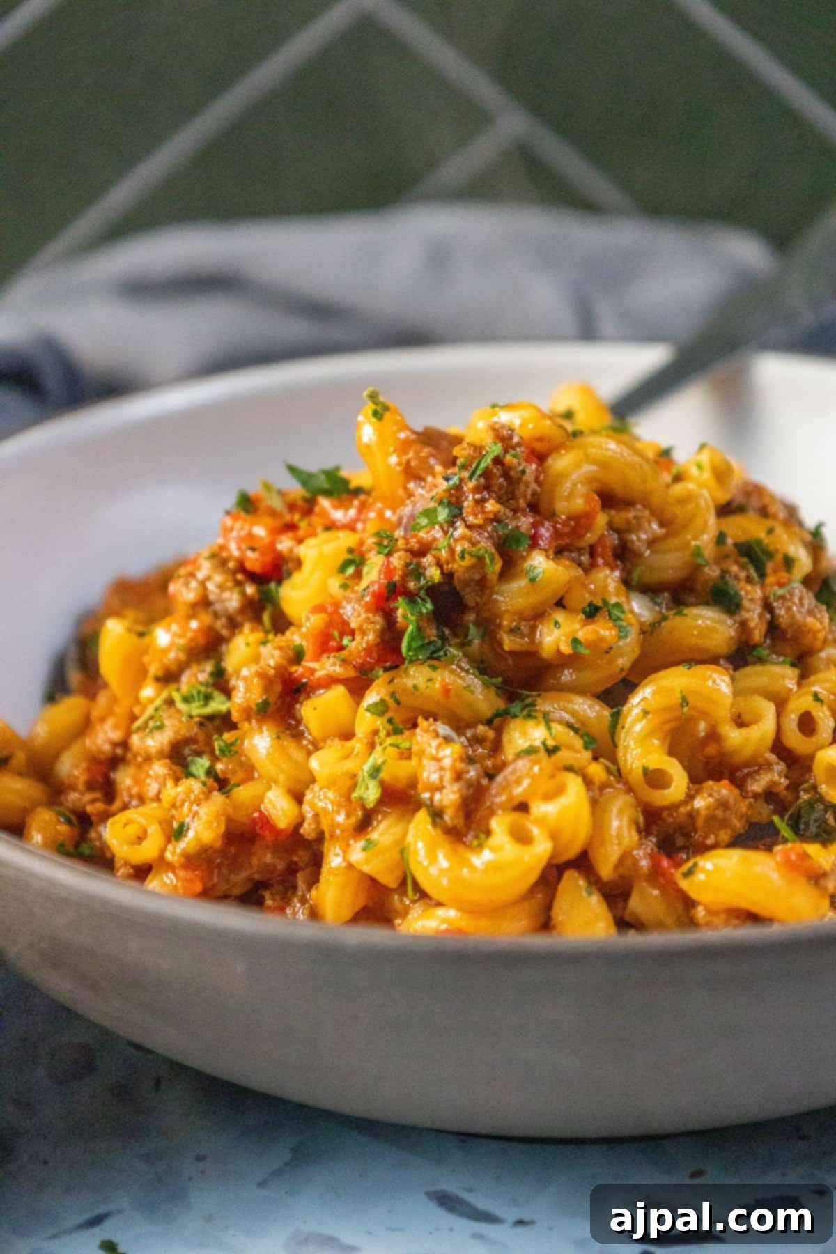 Homestyle American Goulash 4 A flavorful American recipe featuring a hearty bowl of Goulash, a delicious combination of pasta, meat, and sauce.