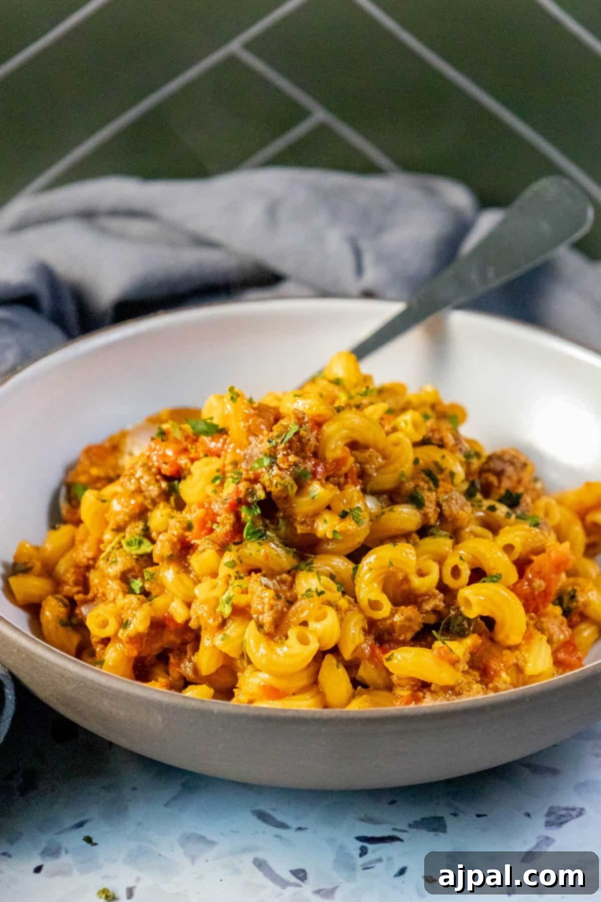 Homestyle American Goulash 9 An American Goulash recipe featuring a bowl of pasta with meat and tomato sauce.