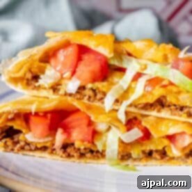 DIY Crunchwrap Delights 15 Homemade Crunchwrap with tomatoes and lettuce.