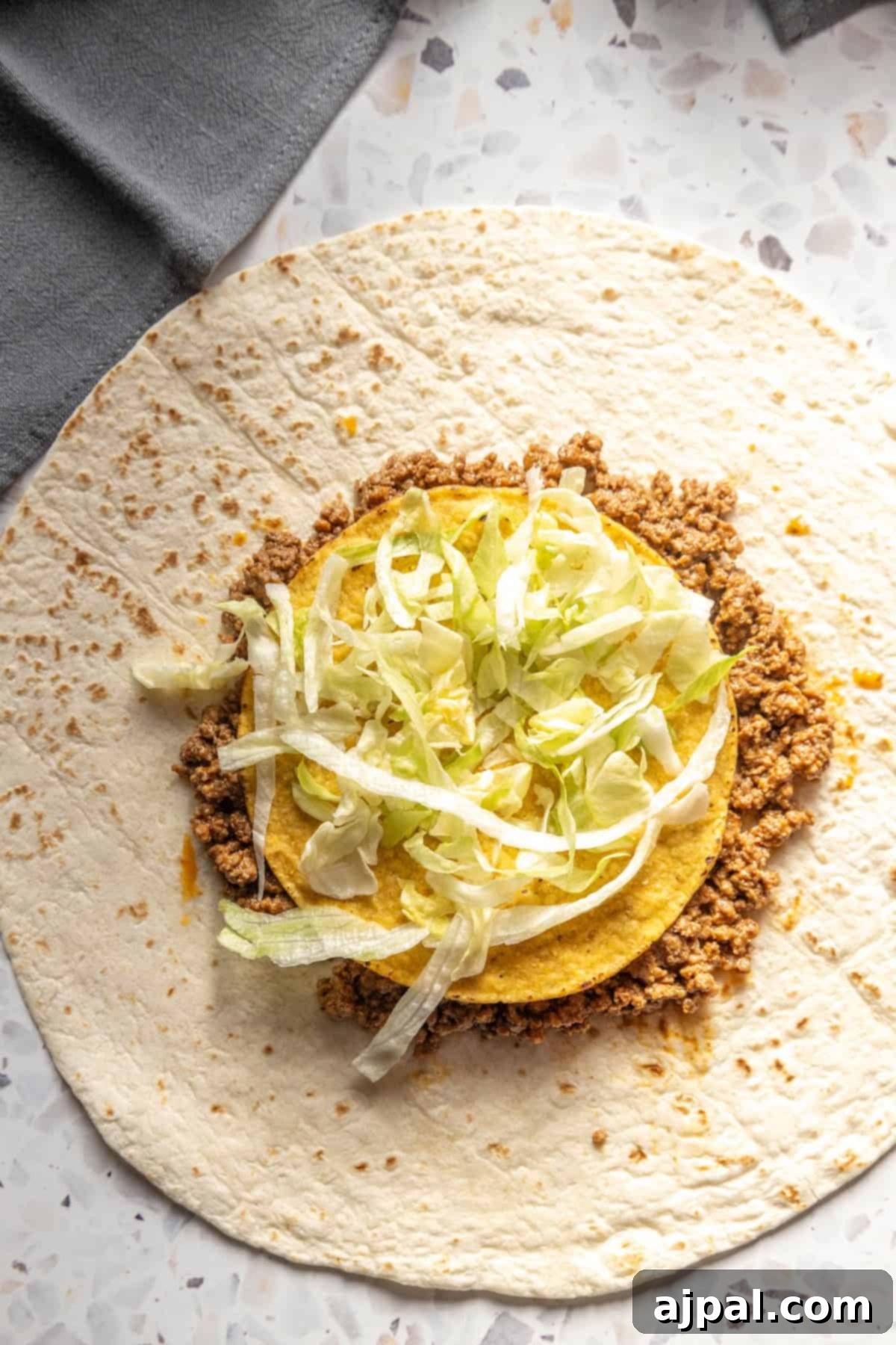 DIY Crunchwrap Delights 8 A homemade burrito filled with hearty meat and crisp cabbage, illustrating the diverse layers of flavor and texture.