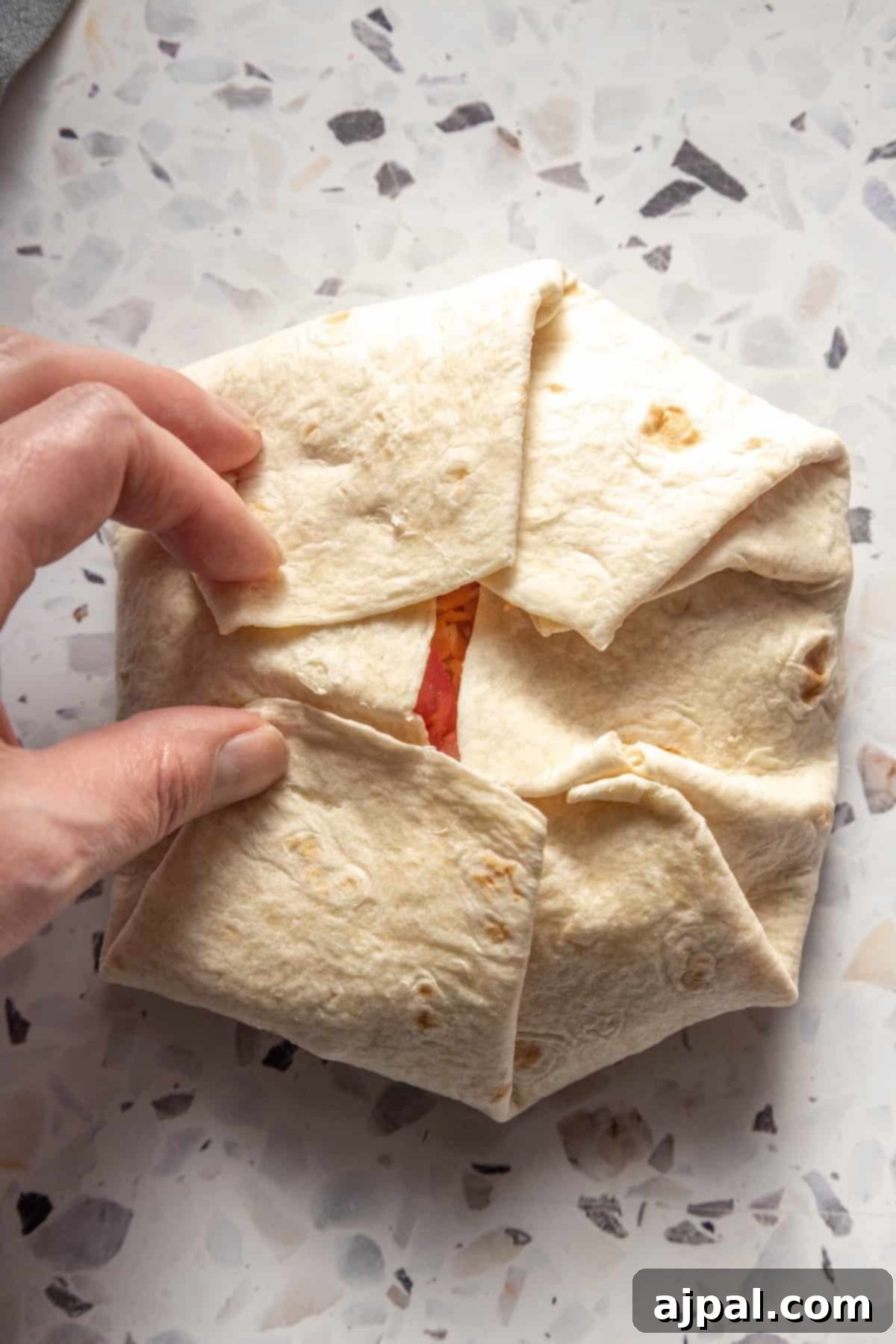 DIY Crunchwrap Delights 10 A person holding a perfectly grilled homemade crunchwrap, highlighting its portability and delicious appeal.