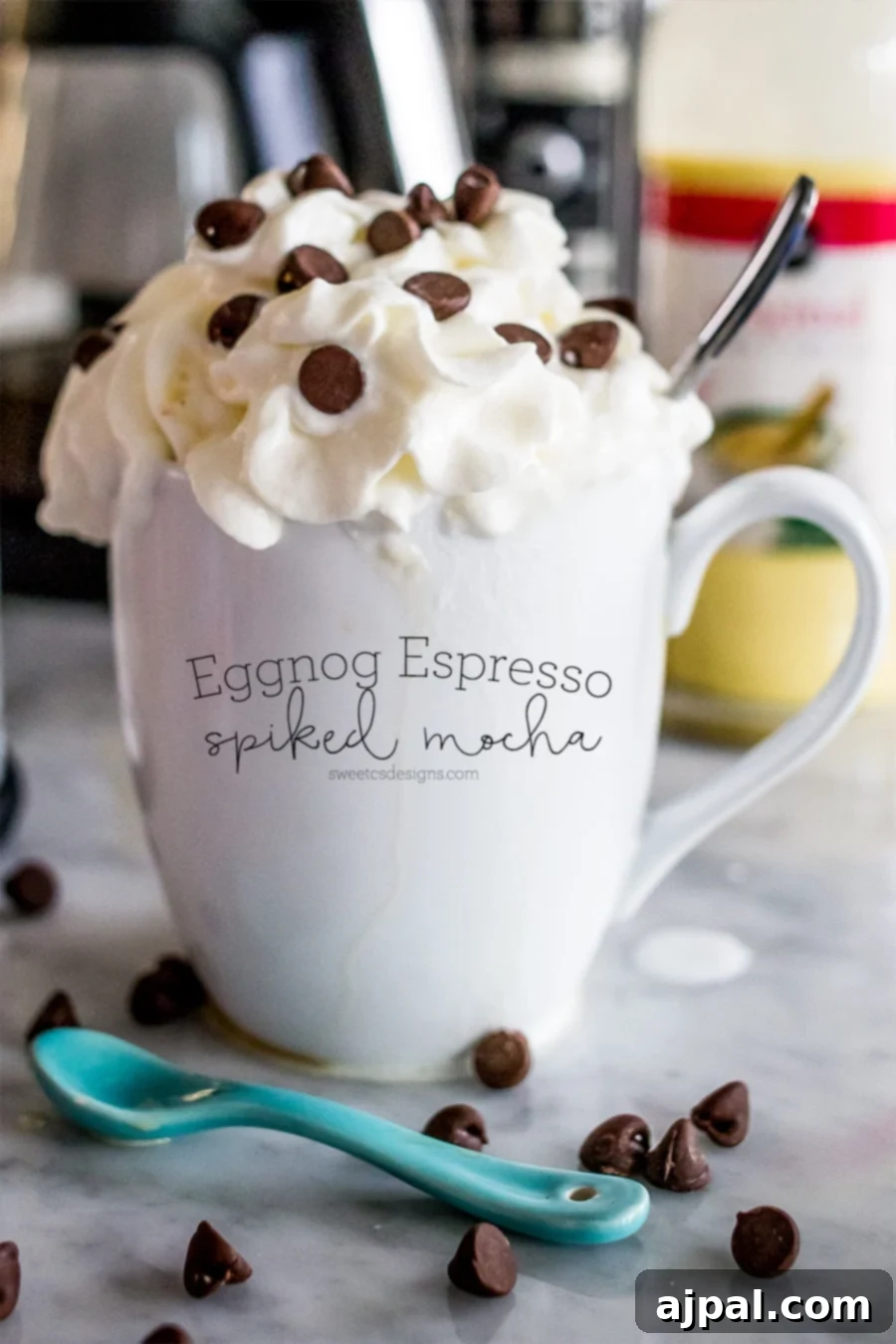 A mocha mug with whipped cream and chocolate chips.
