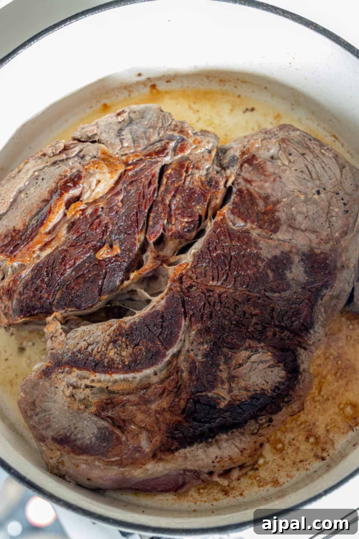 Browning beef roast in a Dutch oven.