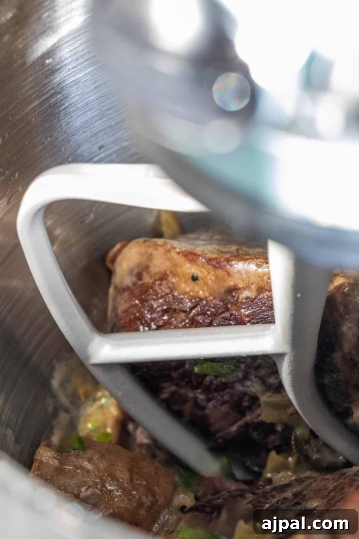 Shredding beef with a stand mixer.
