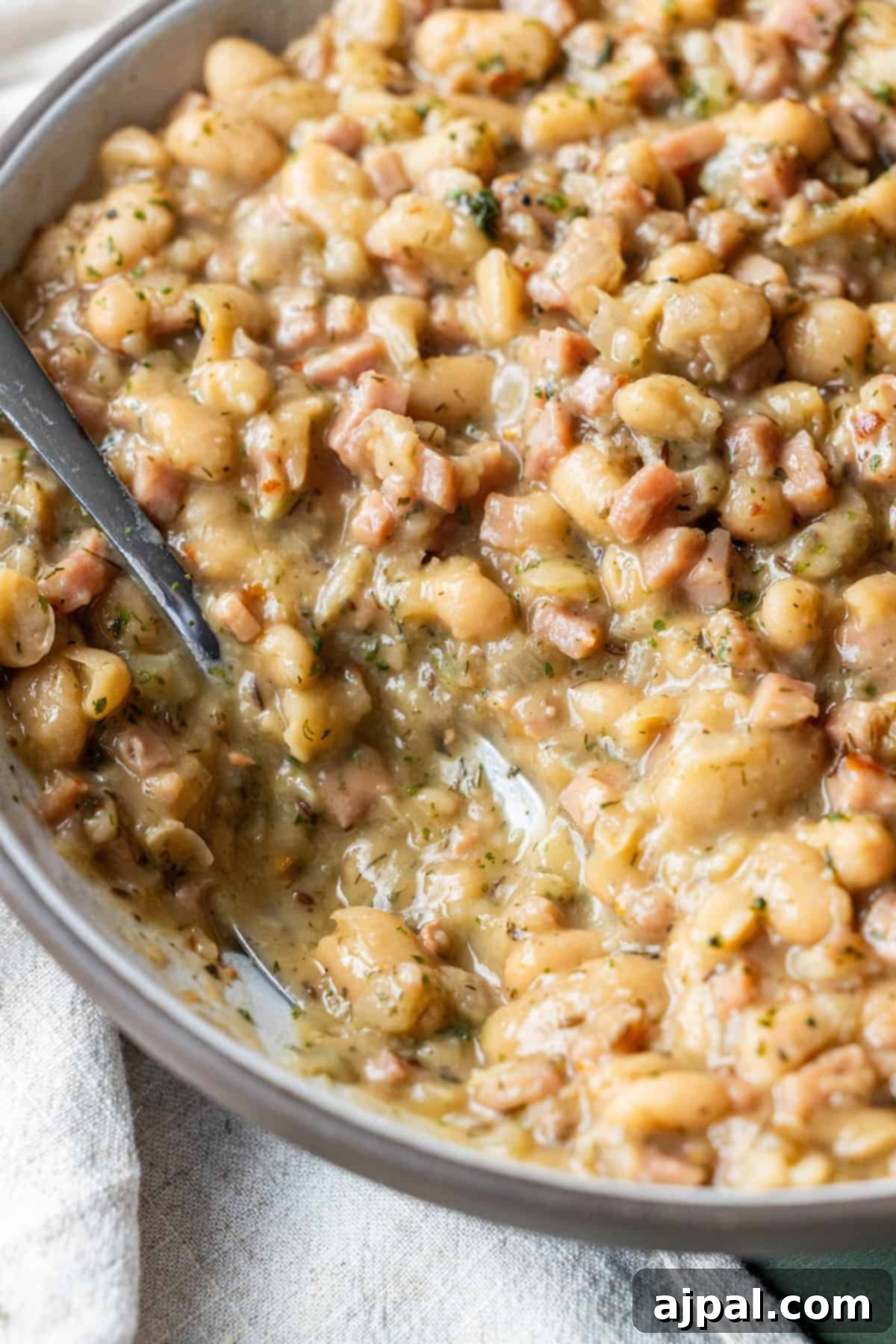 Pan filled with brothy ham and beans
