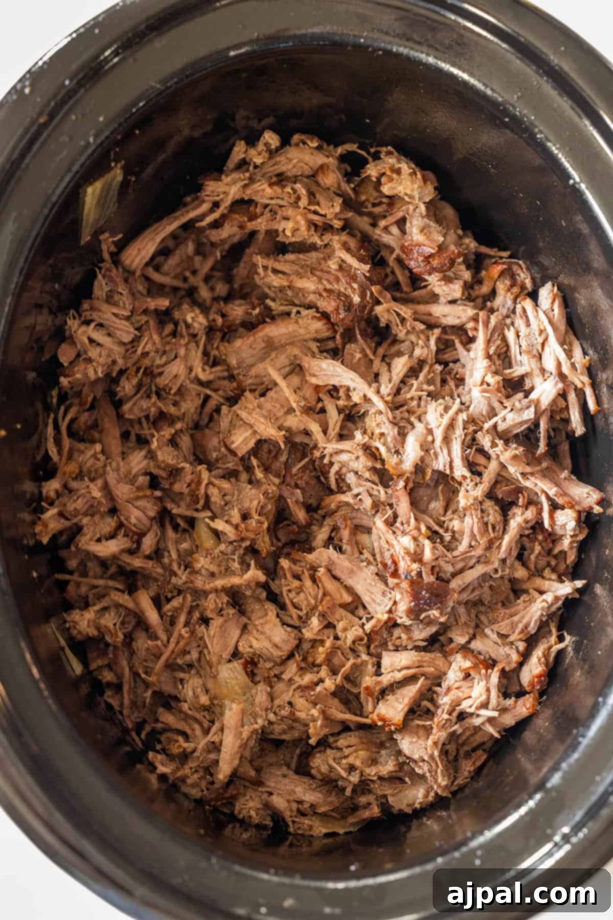 Tender shredded beef in a slow cooker