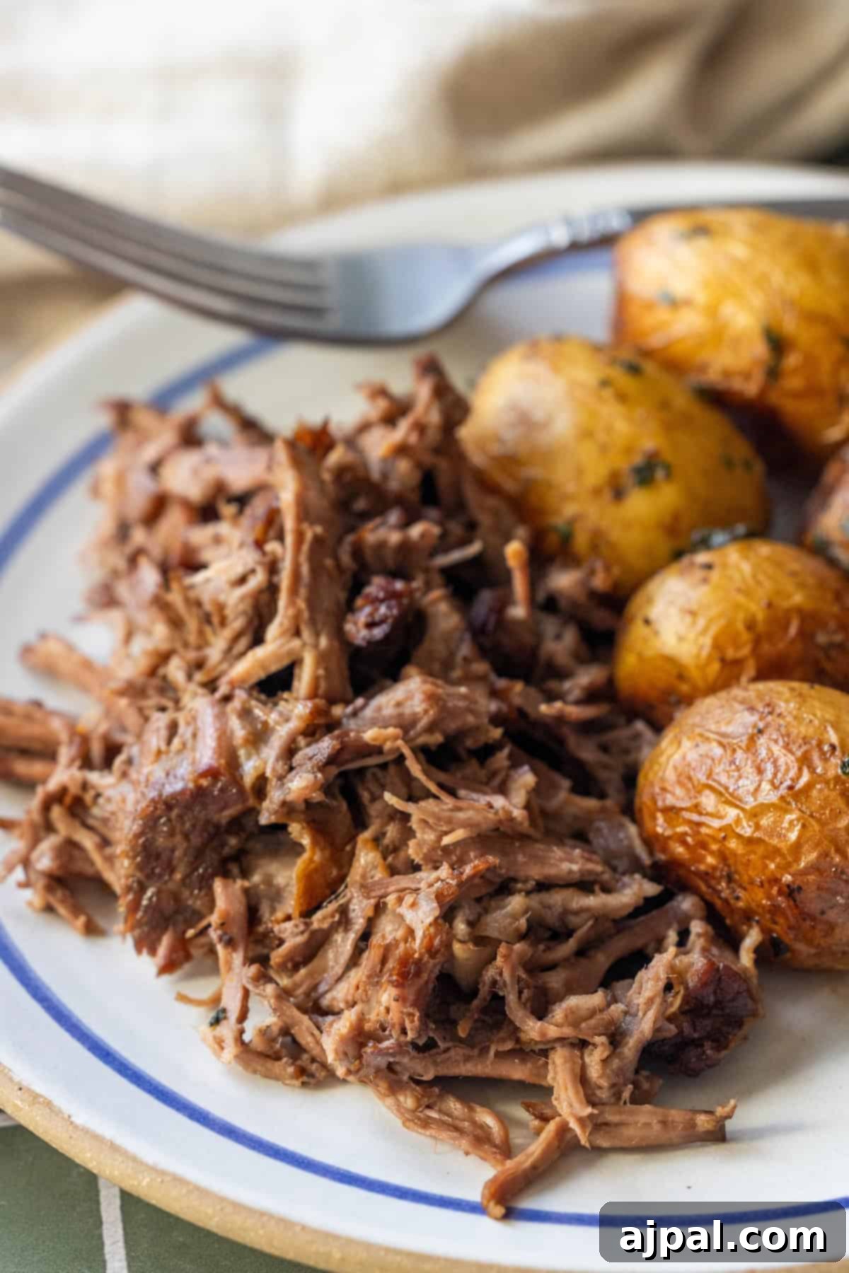 Shredded Slow Cooker Chuck Roast and roasted baby potatoes