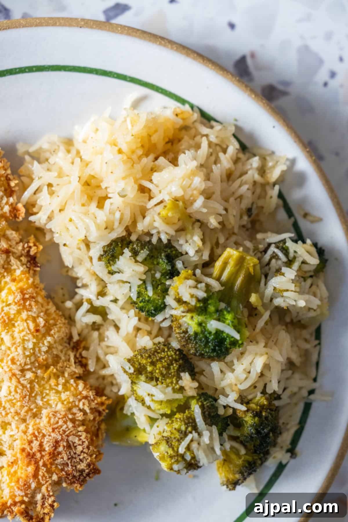 Plate of Baked Ranch Rice and Broccoli served with baked chicken