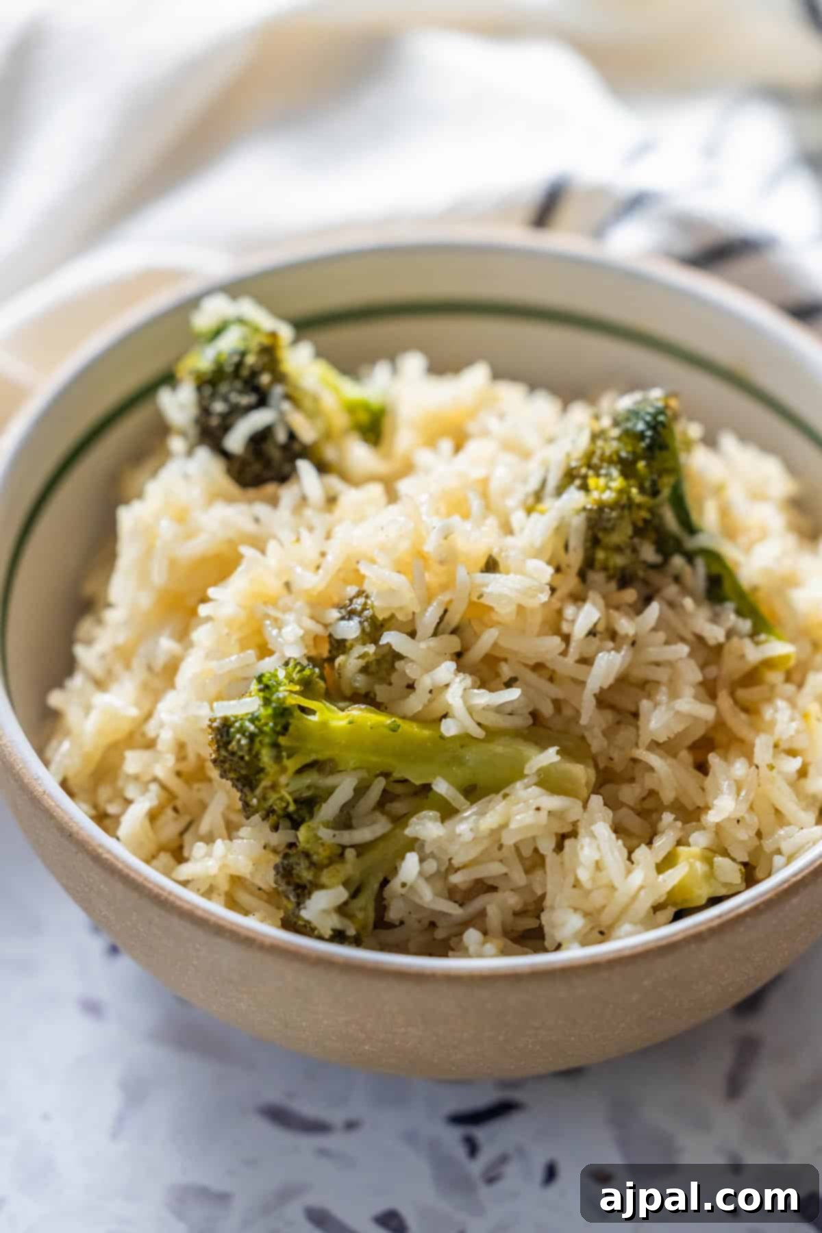 Bowl of Baked Ranch Rice and Broccoli on a light surface