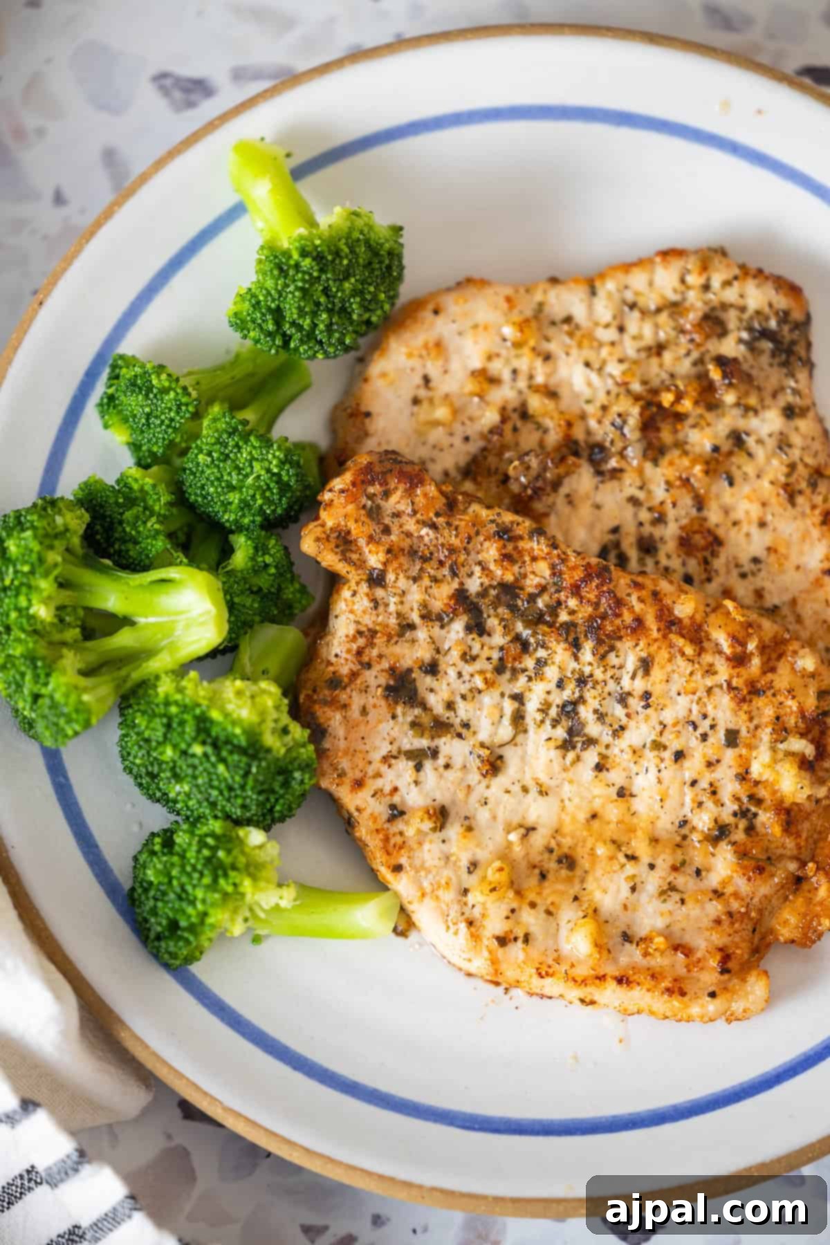 Garlic seasoned pork chops with steamed broccoli