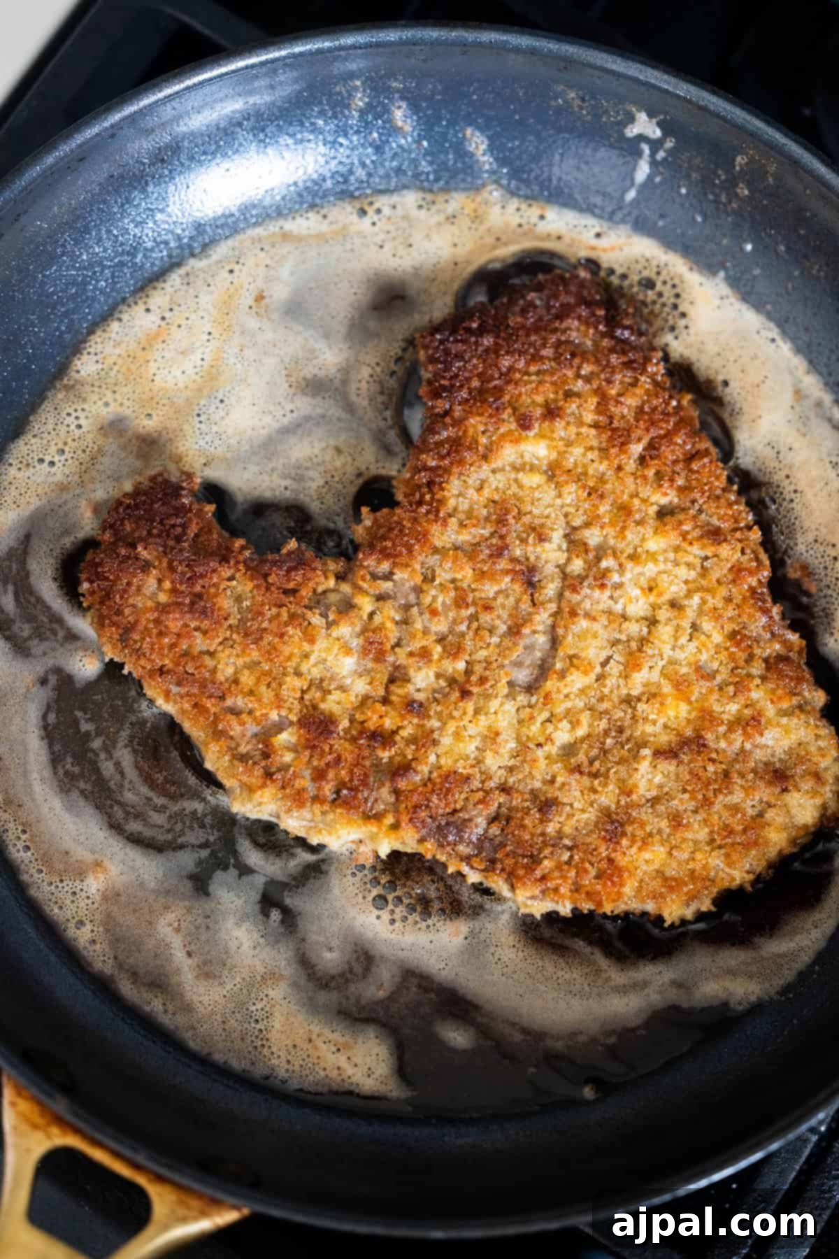 Steak frying in a pan