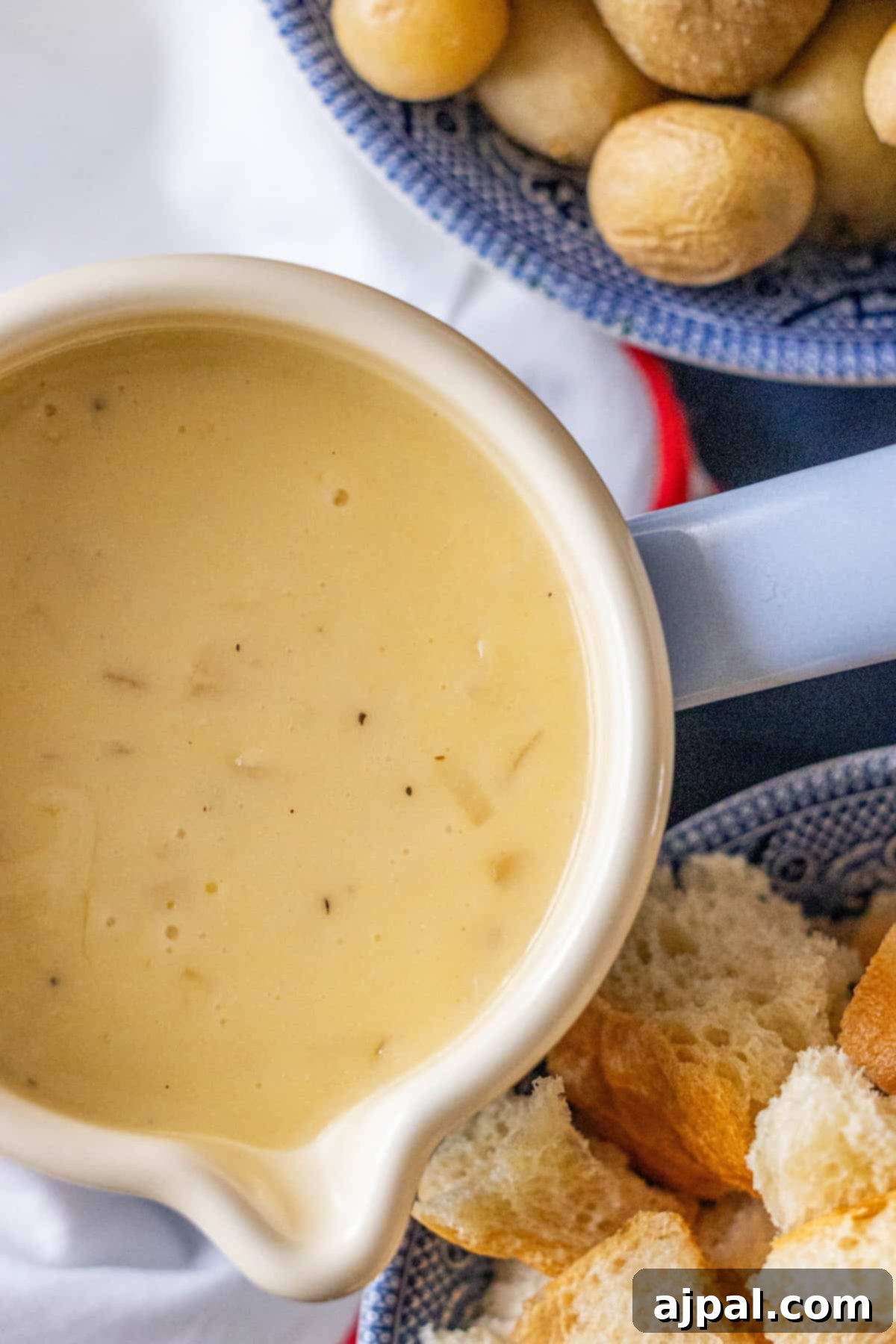 Bowl of cheese fondue with bread