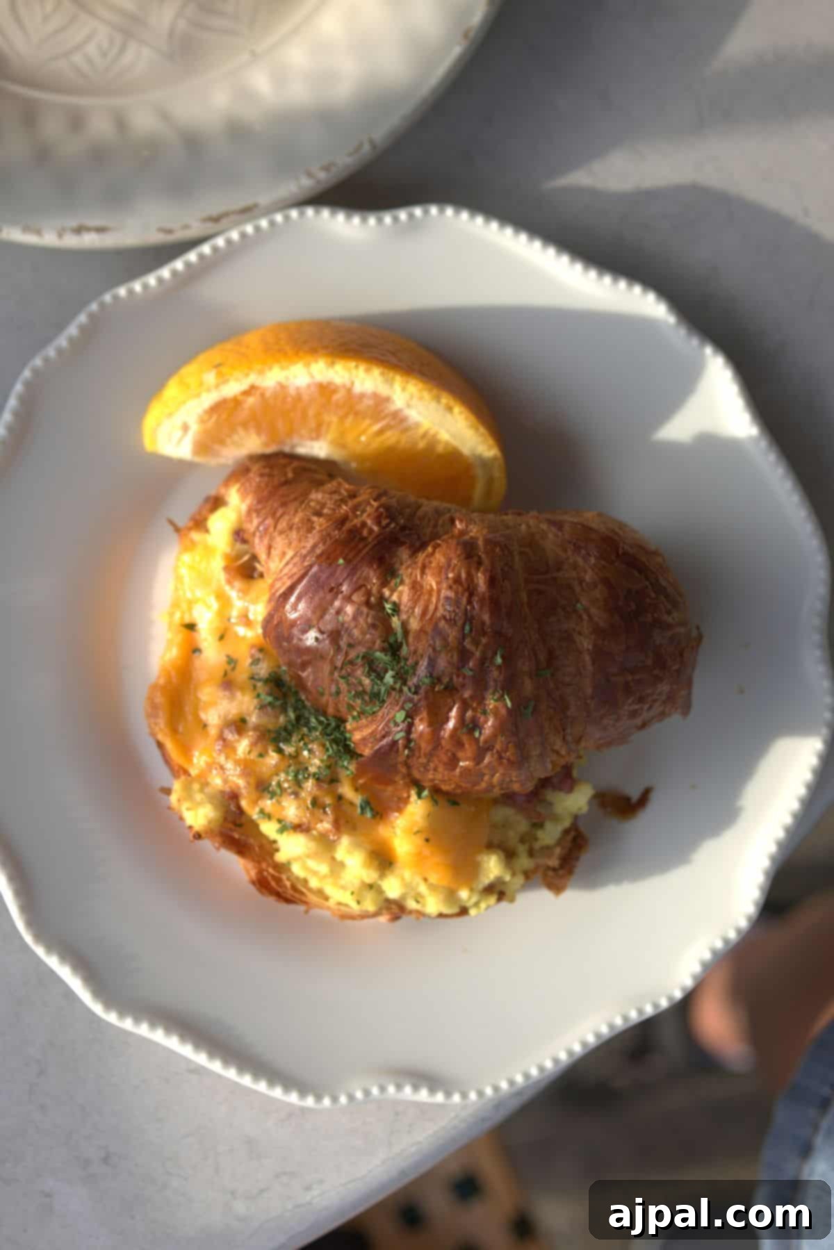 Croissant with eggs and cheese
