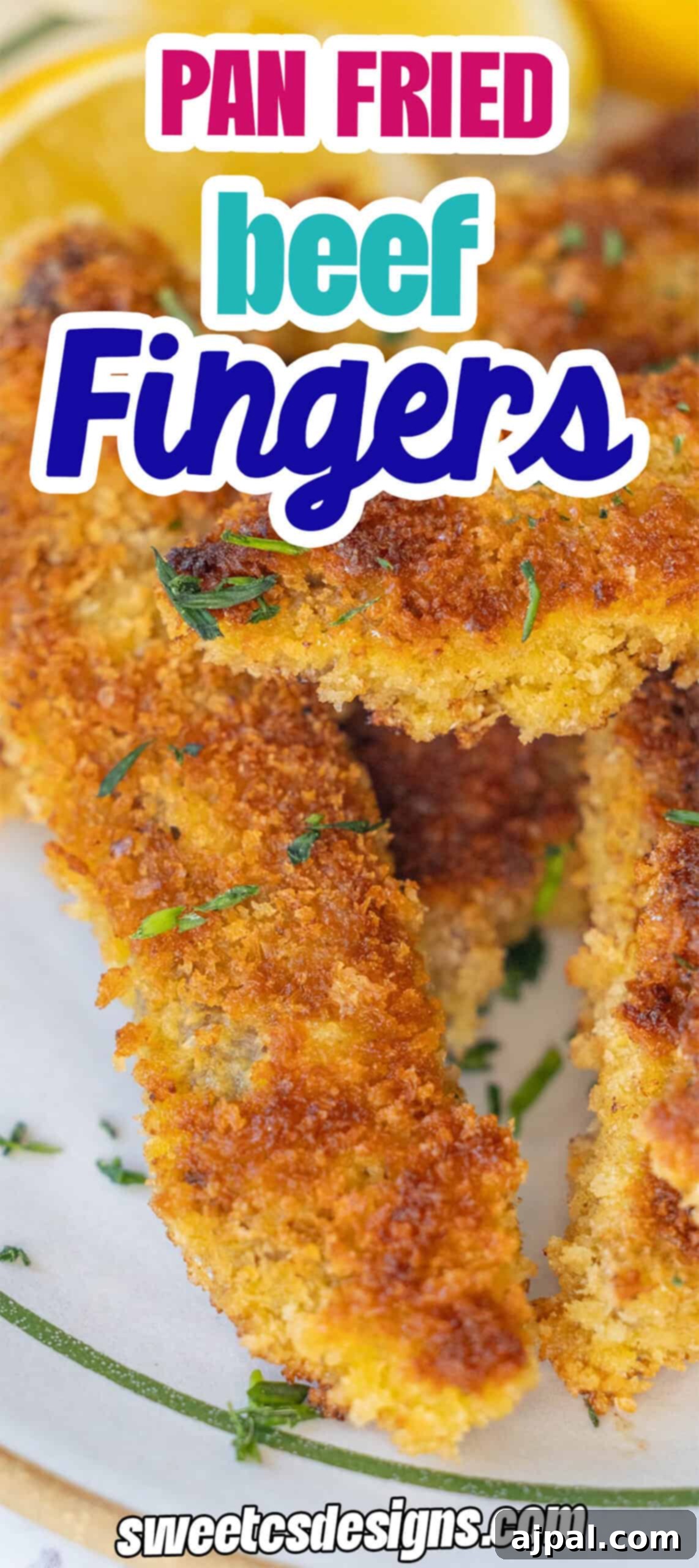 Close-up of crispy, golden-brown steak fingers with herbs and lemon slices