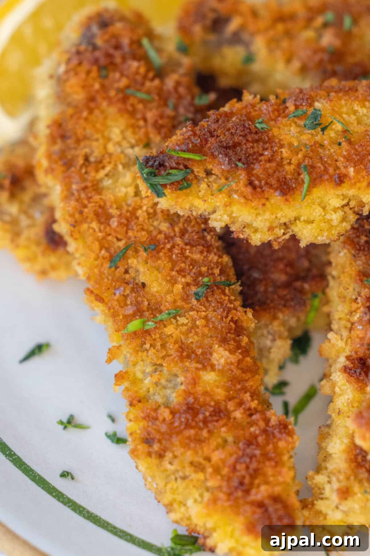 Close-up of crispy steak fingers with herbs