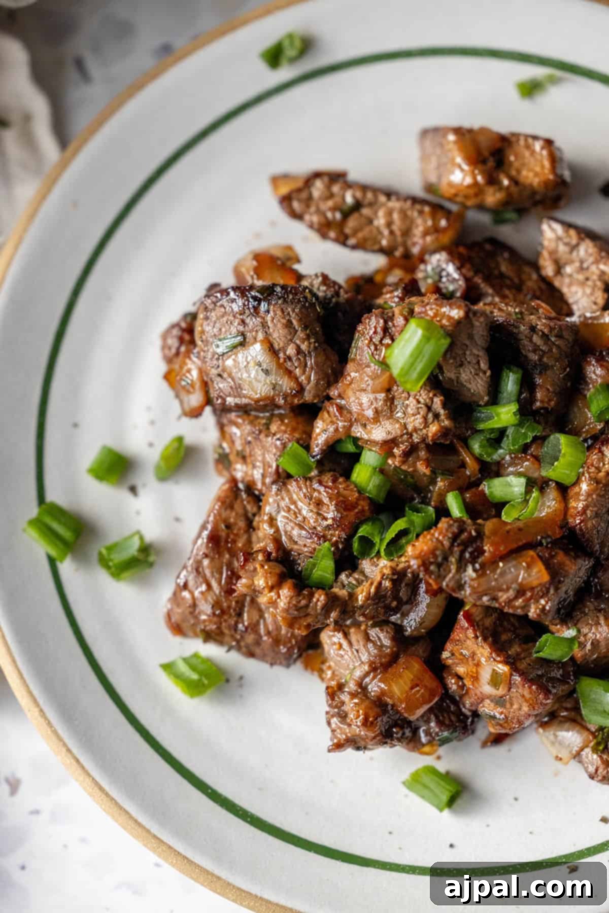 Beef Cubes Garnished with Green Onions