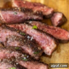 Sliced Denver Steak on a cutting board