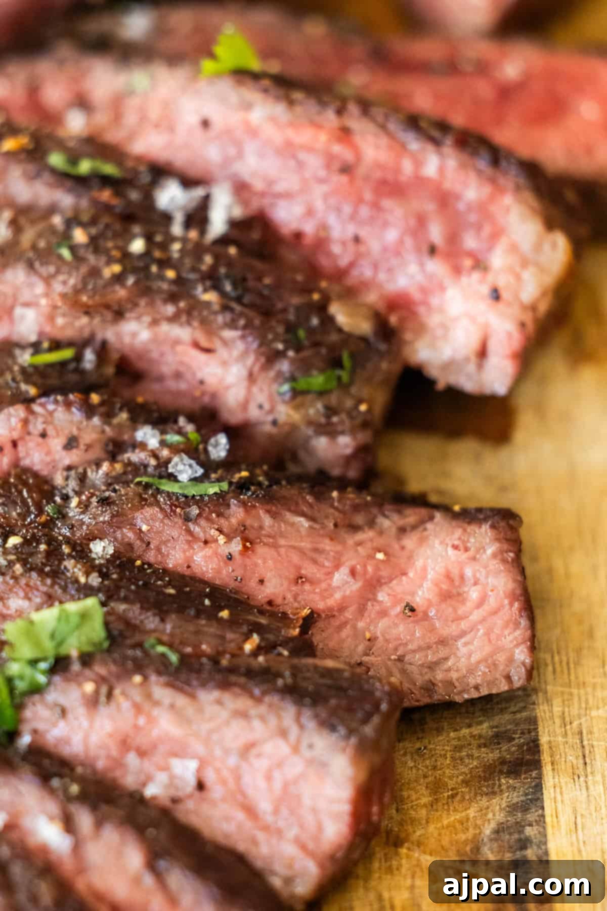 Denver Steak
Denver Cut Delight 9 Close-up of sliced Denver Steak with herbs