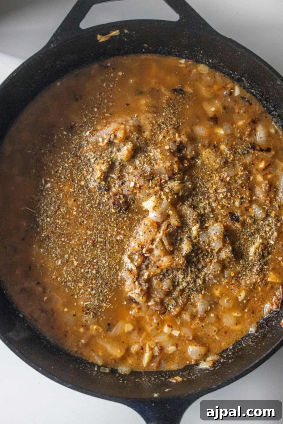 Country Steak in Gravy: A Hearty Homestyle Classic 11 Simmering beef stock, onions, and spices.