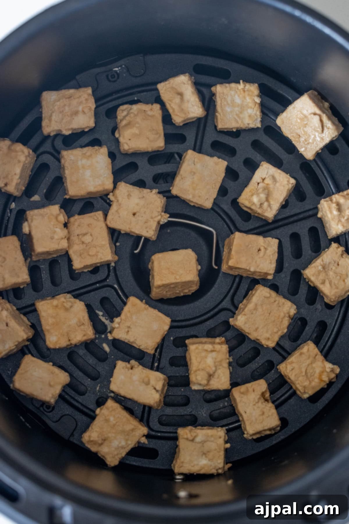 Tofu cubes in the air fryer.
