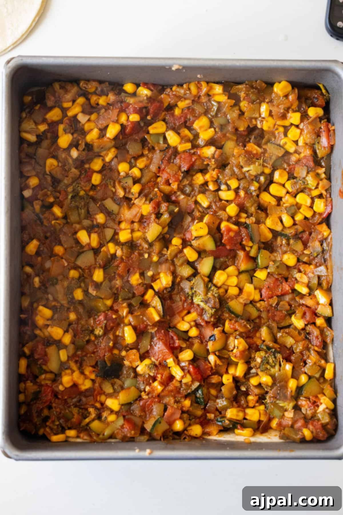 Layer of vegetable mixture in the baking pan
