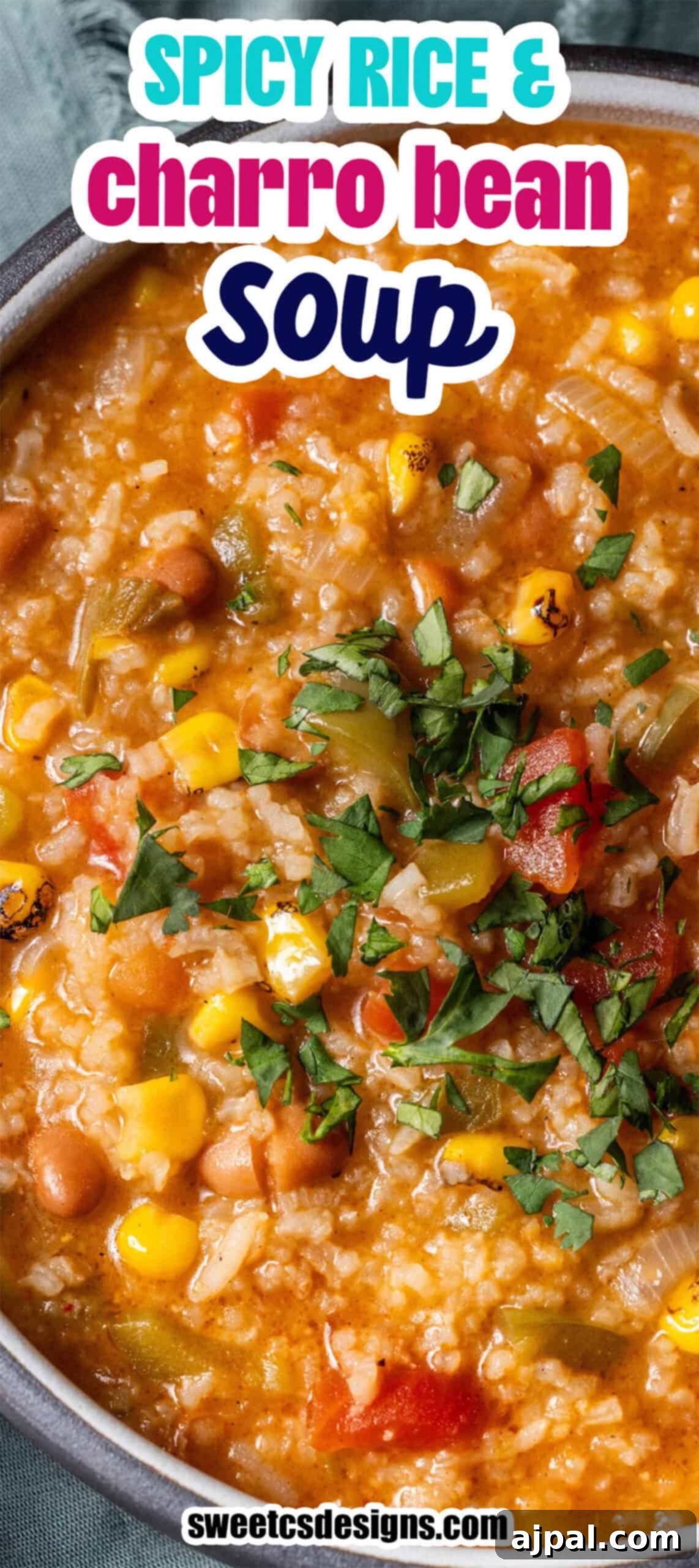 Close-up of vegan spicy rice soup and charro bean soup with corn, tomatoes, beans, and chopped herbs, served in a bowl. Text overlay reads Spicy Rice & Charro Bean Soup.