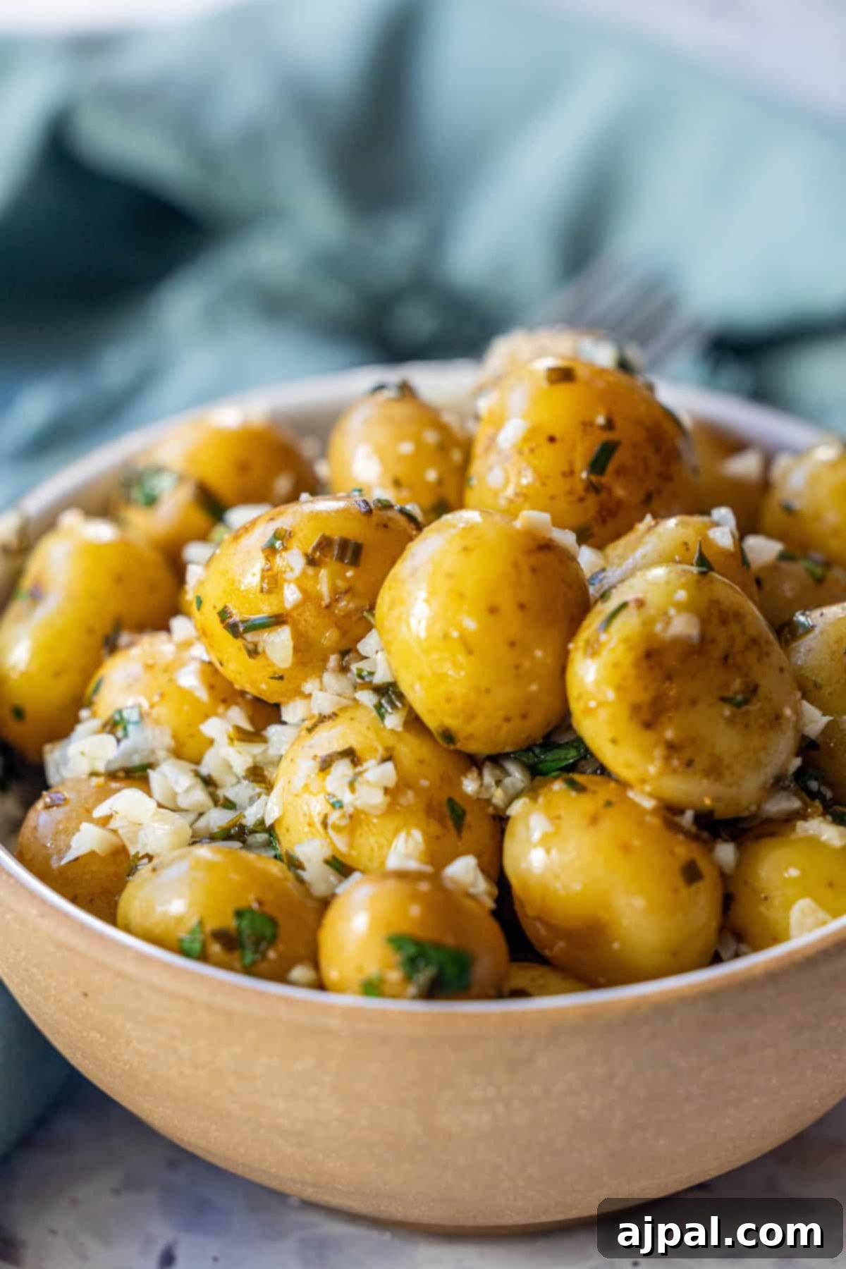 Bowl of Garlic and Chive Potatoes on a Table